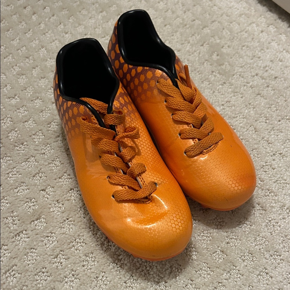 Orange soccer cleats
